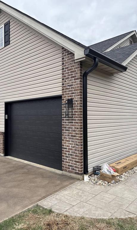 Black seamless gutters installation St. Louis MO — Kodiak